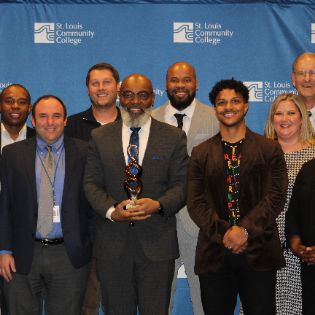  image of superintendent and leaders with photo